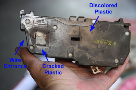 The Heat from the Loose Electrical Connection has Cracked 
                   					 and Discolored the Plastic Housing of the Circuit Breaker