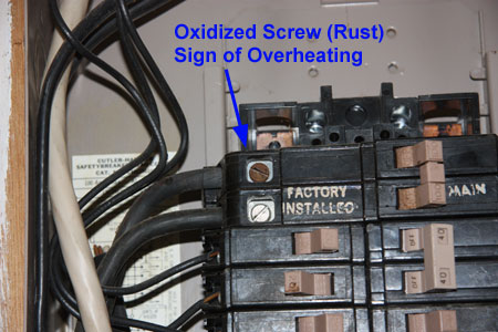 A Loose Electrical Connection has Heated the Screw and Caused it to Oxidized or Rust