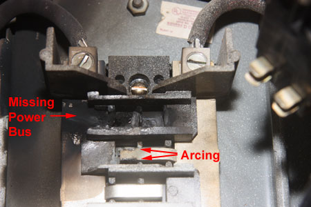 The Loose Circuit Breaker Connection has melted a section of the Panel Power Bus 
                       					and there is arcing on the Power Bus Section Immediate below this