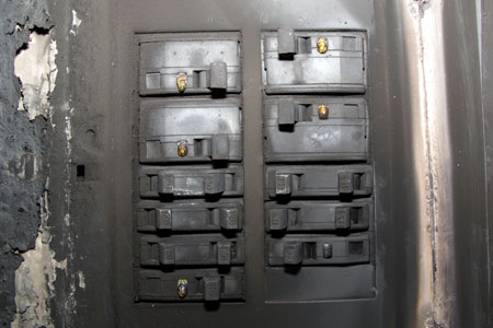 Square D Circuit Breaker with Lenses begining to melt 
                    					- Tripped Circuit Breakers could be due to the temperature of the fire