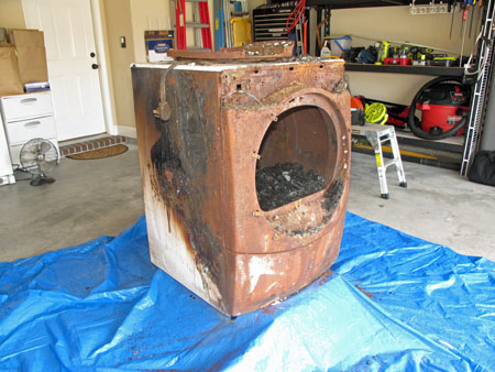 Burned Whirlpool Dryer without a Tag depicting the Model and Serial Number. 