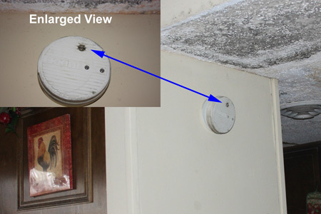 Smoke Alarm Induced Enhanced Soot Deposition